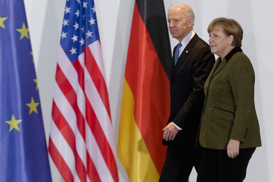 File---File picture taken Friday, Feb. 1, 2013 shows German Chancellor Angela Merkel, right, and United States&#39; Vice President Joe Biden at the chancellery in Berlin, Germany.   (AP Photo/Markus Schreiber,file)