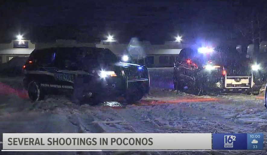 This frame grab from video provided by WNEP-TV shows authorities at one of the scenes in a string of multiple shootings, late Monday, June 18, 2021, in Monroe County, Pa. Authorities say at least four people have been injured in the string of shootings that prompted a shelter-in-place order for some residents north of Mount Pocono. (Courtesy of WNEP TV via AP)