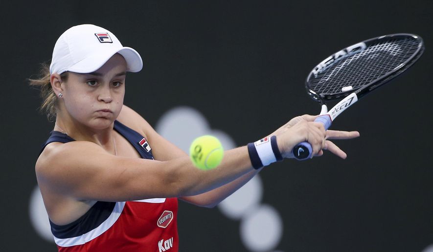 FILE - In this Jan. 10, 2019, file photo, Ash Barty of Australia hits a backhand to Elise Mertens of Belgium during their women&#x27;s singles match at the Sydney International tennis tournament in Sydney. The world No. 1-ranked Barty on Thursday, Jan. 21, 2021, said she&#x27;ll play in a one-day exhibition event in Adelaide on Jan. 29 which includes Serena Williams, Naomi Osaka and Simona Halep. (AP Photo/Rick Rycroft, File)