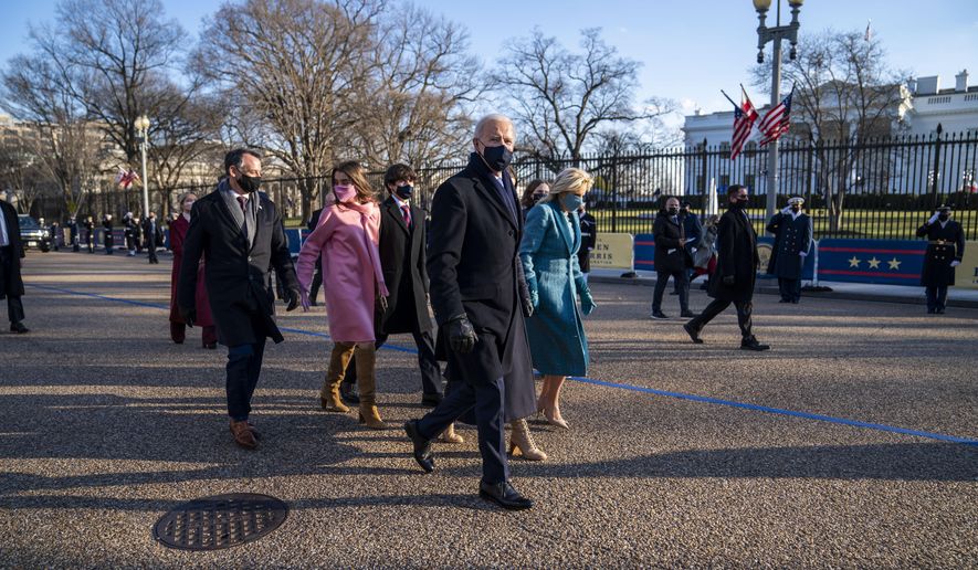 President Joe Biden, First Lady Jill Biden and family, walk in front of the White House during a Presidential Escort to the White House, Wednesday, Jan. 20, 2021 in Washington.  (Doug Mills/The New York Times via AP, Pool)