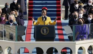 National youth poet laureate Amanda Gorman recites her inaugural poem during the 59th Presidential Inauguration at the U.S. Capitol in Washington, Wednesday, Jan. 20, 2021. Joe Biden became the 46th president of the United States on Wednesday. (AP Photo/Patrick Semansky, Pool)
