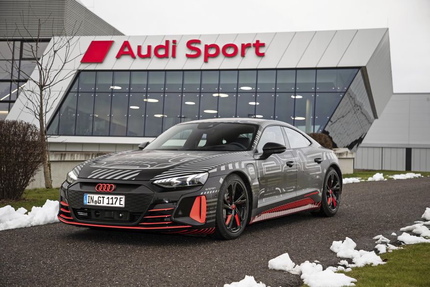 This photo provided by Audi shows the Audi e-tron GT prototype, a fully electric sport sedan that promises equal parts speed and long-distance comfort. (Daniel Wollstein/Audi via AP)