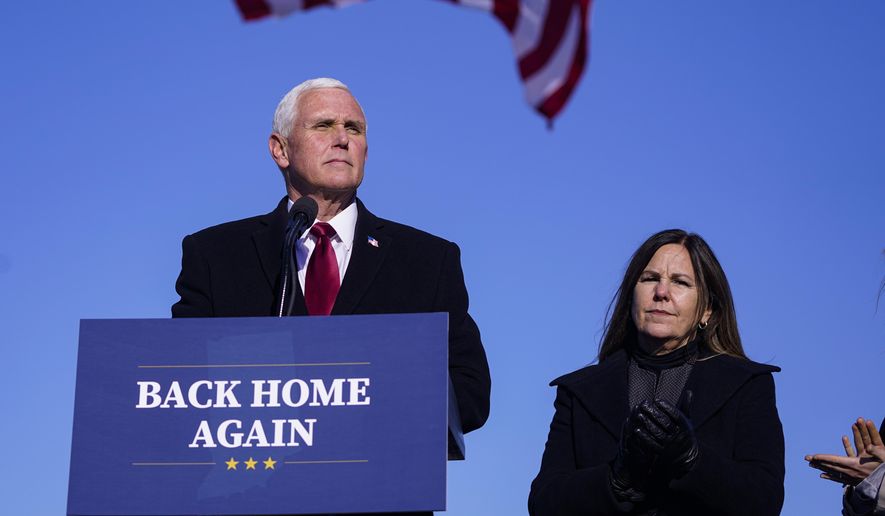 Former Vice President Mike Pence speaks after arriving back in his hometown of Columbus, Ind., Wednesday, Jan. 20, 2021. Pence has returned to his Indiana hometown, where he told a small crowd that serving in the White House was the greatest honor of his life. Pence flew on a government plane Wednesday afternoon into the Columbus Municipal Airport with his wife, Karen, after attending President Joe Biden’s inauguration. (AP Photo/Michael Conroy)