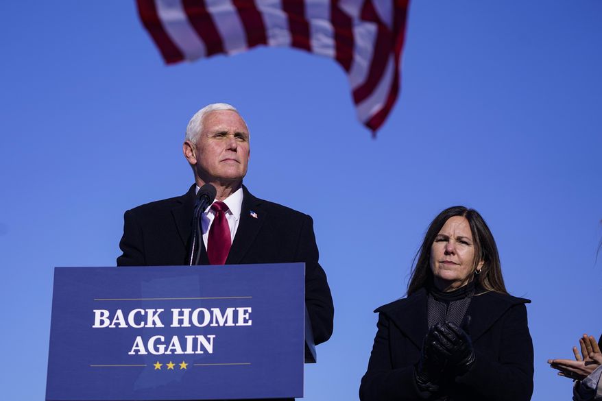 Former Vice President Mike Pence speaks after arriving back in his hometown of Columbus, Ind., Wednesday, Jan. 20, 2021. Pence has returned to his Indiana hometown, where he told a small crowd that serving in the White House was the greatest honor of his life. Pence flew on a government plane Wednesday afternoon into the Columbus Municipal Airport with his wife, Karen, after attending President Joe Biden’s inauguration. (AP Photo/Michael Conroy)