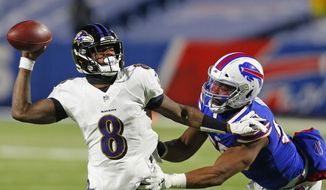 Buffalo Bills defensive end Jerry Hughes (55) pressures Baltimore Ravens quarterback Lamar Jackson (8) during the second half of an NFL divisional round football game Saturday, Jan. 16, 2021, in Orchard Park, N.Y. (AP Photo/Jeffrey T. Barnes)