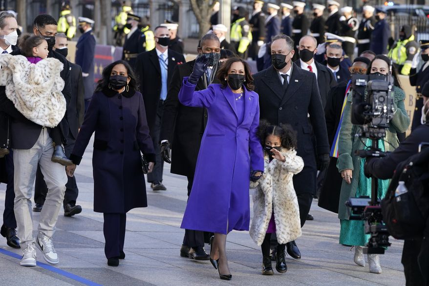 Vice President Kamala Harris, and her husband Doug Emhoff, and family, walk in front of the White House during a Presidential Escort to the White House, Wednesday, Jan. 20, 2021 in Washington, after being sworn in as the 46th vice president of the United States. (AP Photo/Jacquelyn Martin)