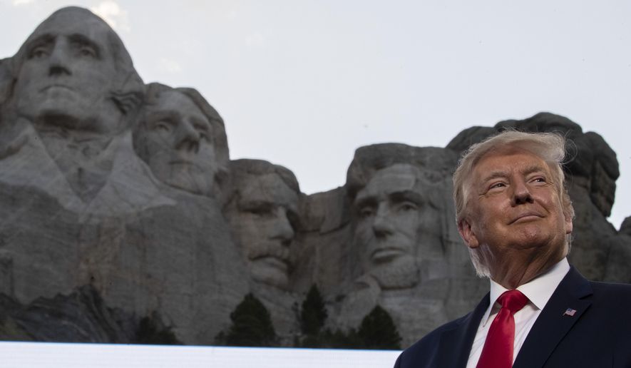 In this July 3, 2020, photo, President Donald Trump stands at Mount Rushmore National Memorial, near Keystone, S.D. South Dakota Gov. Kristi Noem says she gave former president Donald Trump a $1,100 bust depicting the president on Mount Rushmore last year because she knew it was something he wanted to receive. The gift was presented to Trump when he visited South Dakota on Friday, July 3, 2020 for an Independence Day fireworks celebration. (AP Photo/Alex Brandon) **FILE**