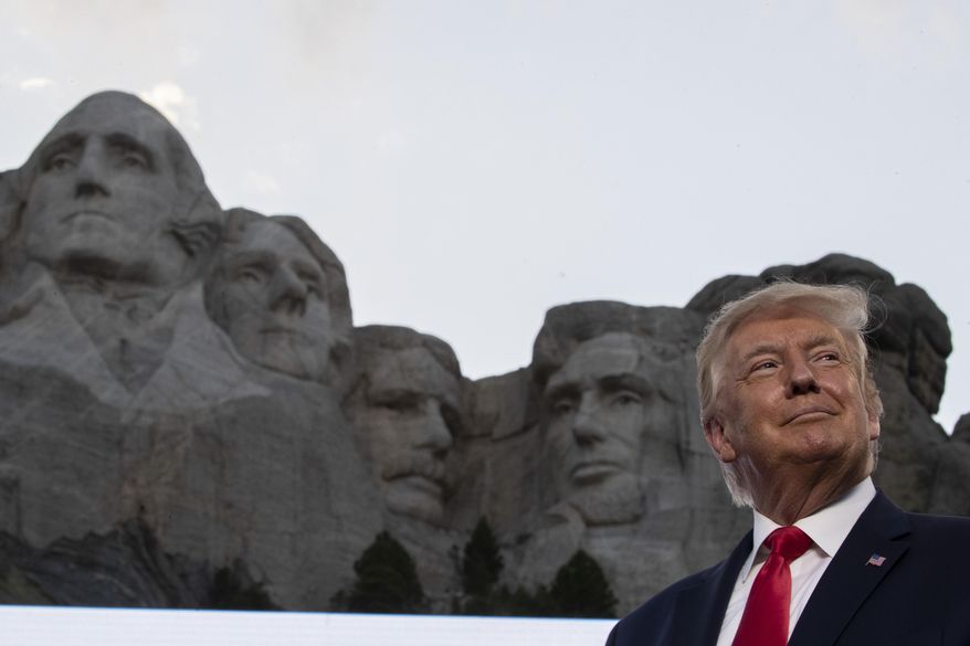 In this July 3, 2020, photo, President Donald Trump stands at Mount Rushmore National Memorial, near Keystone, S.D. South Dakota Gov. Kristi Noem says she gave former president Donald Trump a $1,100 bust depicting the president on Mount Rushmore last year because she knew it was something he wanted to receive. The gift was presented to Trump when he visited South Dakota on Friday, July 3, 2020 for an Independence Day fireworks celebration. (AP Photo/Alex Brandon) **FILE**