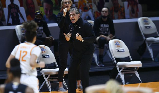 Connecticut coach Geno Auriemma shouts during the team&#x27;s NCAA college basketball game against Tennessee in Knoxville, Tenn., Thursday, Jan. 21, 2021. (Saul Young/Knoxville News Sentinel via AP, Pool)