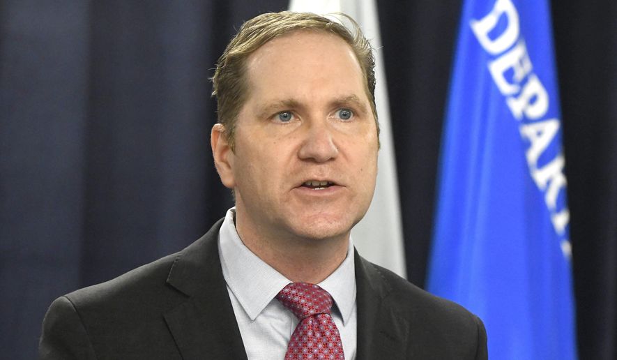 FILE - In this Dec. 14, 2020, file photo, U.S. Attorney Matthew Schneider speaks during a press conference in Detroit, Mich. Schneider, the chief federal prosecutor in eastern Michigan said he's leaving office on Feb. 1, 2021, to join a law firm. Schneider was picked by President Donald Trump and served for three years. Changes are common when a new president from a different party is elected. (Daniel Mears/Detroit News via AP, File)