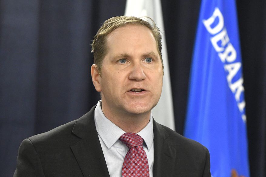FILE - In this Dec. 14, 2020, file photo, U.S. Attorney Matthew Schneider speaks during a press conference in Detroit, Mich. Schneider, the chief federal prosecutor in eastern Michigan said he's leaving office on Feb. 1, 2021, to join a law firm. Schneider was picked by President Donald Trump and served for three years. Changes are common when a new president from a different party is elected. (Daniel Mears/Detroit News via AP, File)
