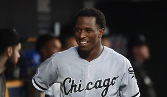FILE - In this Sept. 20, 2019, file photo, Chicago White Sox&#39;s Tim Anderson smiles in the dugout during the second inning of the team&#39;s baseball game against the Detroit Tigers in Detroit. Anderson landed a spot on a video game cover Thursday, Jan.21. He&#39;d like a World Series ring to go with it. Anderson sees no reason why the White Sox can&#39;t win it all after loading up on the heels of a breakthrough playoff season. (AP Photo/Paul Sancya, File)