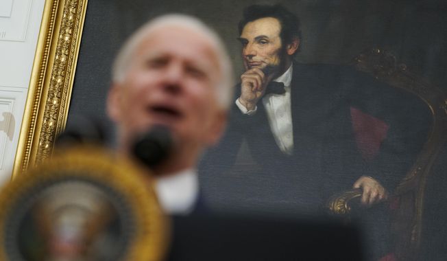 A portrait of former President Abraham Lincoln President hangs in the State Dining Room of the White House as Joe Biden delivers remarks on the economy Friday, Jan. 22, 2021, in Washington. (AP Photo/Evan Vucci)