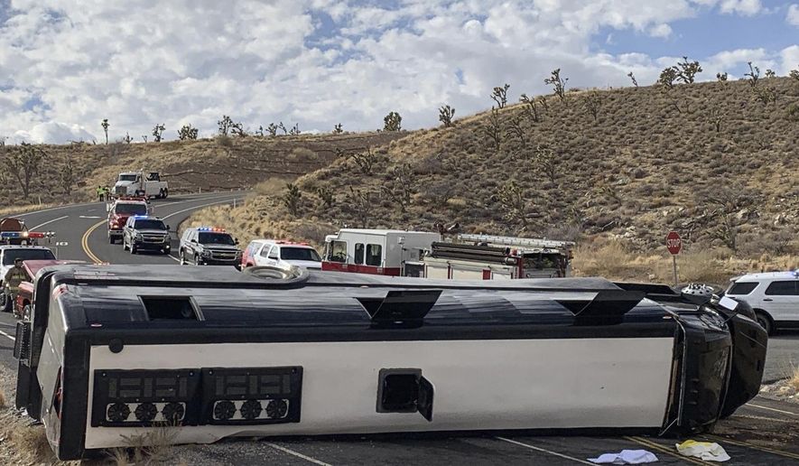 This photo provided by the Mohave County Sheriff&#x27;s Office shows a Las Vegas-based tour that rolled over in northwestern Arizona on Friday, Jan. 22, 2021. One person died, and two were critically injured. The cause of the rollover is under investigation. (Mohave County Sheriff&#x27;s Office via AP)