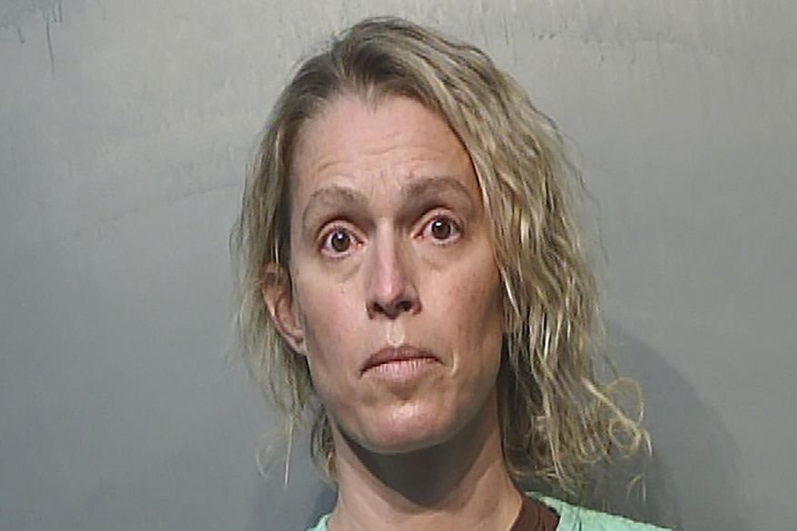 This Jan. 21, 2021, photo provided by the Polk County Jail in Des Moines, Iowa shows Jennifer Woodley. Former Make-A-Wish Iowa CEO Jennifer Woodley is charged with first-degree theft and unauthorized use of a credit card. The organization announced last summer that she had been terminated as CEO after it discovered financial irregularities during a compliance review. (Polk County Jail via AP)