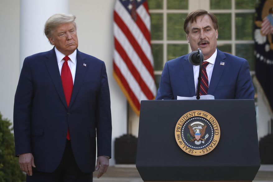 In this March 30, 2020 file photo, MyPillow CEO Mike Lindell speaks as President Donald Trump listens during a briefing about the coronavirus in the Rose Garden of the White House, in Washington. (AP Photo/Alex Brandon, File)