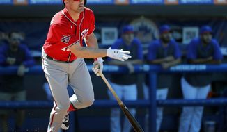 FILE - In this March 1, 2020, file photo, Washington Nationals&#39; Ryan Zimmerman watches his double during the fourth inning of a spring training baseball game against the New York Mets in Port St. Lucie, Fla. Zimmerman is returning to the Nationals after sitting out the pandemic-shortened 2020 season. A person familiar with the negotiations told The Associated Press that Zimmerman agreed to a $1 million, one-year contract that would include additional bonus provisions. (AP Photo/Jeff Roberson, File)