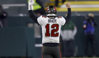 Tampa Bay Buccaneers quarterback Tom Brady reacts after winning the NFC championship NFL football game against the Green Bay Packers in Green Bay, Wis., Sunday, Jan. 24, 2021. The Buccaneers defeated the Packers 31-26 to advance to the Super Bowl. (AP Photo/Jeffrey Phelps)