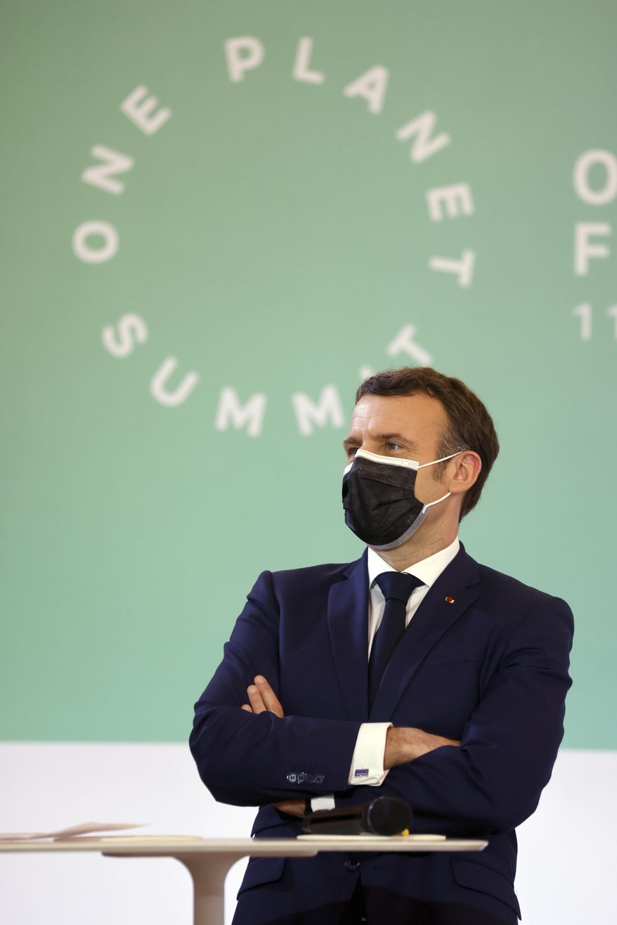 In this Jan. 11, 2021, file photo, French President Emmanuel Macron stands during the One Planet Summit, at The Elysee Palace, in Paris, France. (Ludovic Marin, Pool Photo via AP, File)
