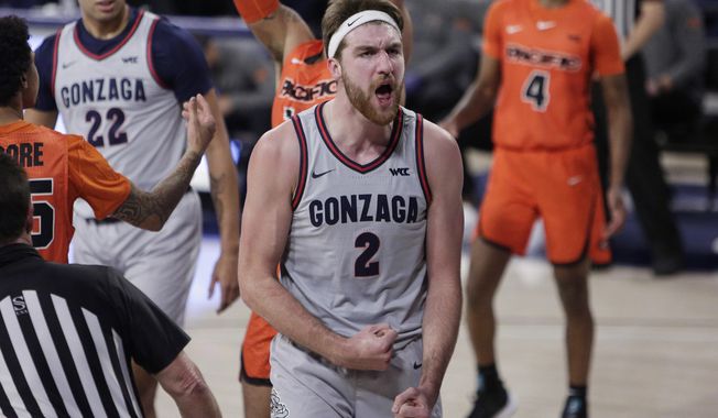 Gonzaga forward Drew Timme celebrates after scoring a basket during the first half of the team&#x27;s NCAA college basketball game against Pacific in Spokane, Wash., Saturday, Jan. 23, 2021. (AP Photo/Young Kwak)