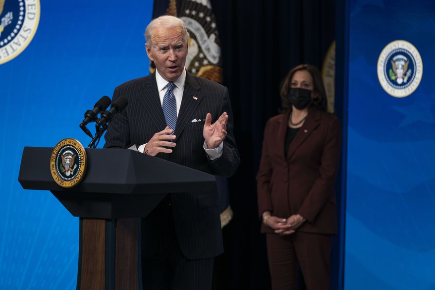 Vice President Kamala Harris listens as President Joe Biden answers questions from reporters in the South Court Auditorium on the White House complex, Monday, Jan. 25, 2021, in Washington. (AP Photo/Evan Vucci)