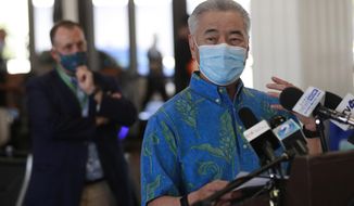 FILE - In this Oct. 15, 2020, file photo, Hawaii Gov. David Ige speaks at a news conference at the Daniel K. Inouye International Airport in Honolulu. On Monday, Jan. 25, 2021, Ige asked residents to be ready for more tough times ahead as the state grapples with a large budget shortfall caused by a coronavirus pandemic that&#39;s pummeled the tourism industry, but said improved tax revenue forecasts mean he&#39;s not currently seeking broad-based tax increases. (AP Photo/Marco Garcia, File)