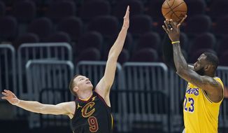 Los Angeles Lakers&#39; LeBron James (23) shoots over Cleveland Cavaliers&#39; Dylan Windler (9) in the first half of an NBA basketball game, Monday, Jan. 25, 2021, in Cleveland. (AP Photo/Tony Dejak)