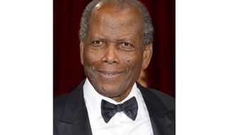 FILE - Actor Sidney Poitier arrives at the Oscars in Los Angeles on March 2, 2014. Arizona State University has named its new film school after Poitier. The university, which is expanding its existing film program into its own school, says it has invested millions of dollars in technology to create one of the largest, most accessible and most diverse film schools. The Sidney Poitier New American Film School will be unveiled at a ceremony on Monday, Jan. 25, 2021. (Photo by Dan Steinberg/Invision/AP, File)