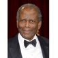 FILE - Actor Sidney Poitier arrives at the Oscars in Los Angeles on March 2, 2014. Arizona State University has named its new film school after Poitier. The university, which is expanding its existing film program into its own school, says it has invested millions of dollars in technology to create one of the largest, most accessible and most diverse film schools. The Sidney Poitier New American Film School will be unveiled at a ceremony on Monday, Jan. 25, 2021. (Photo by Dan Steinberg/Invision/AP, File)