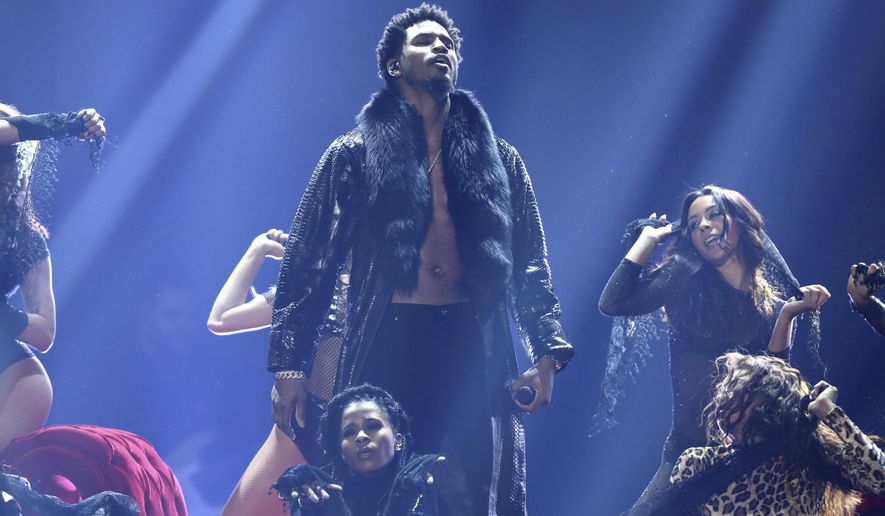 FILE - Trey Songz performs at the BET Awards in Los Angeles on June 25, 2017. Songz was arrested during the AFC Championship game in Kansas City, Mo., after police said he refused to wear a mask and then punched an officer who was trying to remove him from the stadium. Songz, whose name is Tremaine Aldon Neverson, was released Monday, Jan. 25, 2021, from the Jackson County jail. (Photo by Matt Sayles/Invision/AP, File)