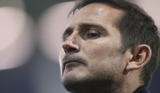 FILE - In this Sunday, Sept. 26, 2020 file photo, Chelsea&#x27;s head coach Frank Lampard looks on after the English Premier League soccer match between West Bromwich Albion and Chelsea at the Hawthorns in West Bromwich, England.  Lampard has been fired by Chelsea halfway through his second season in charge of the London club on Monday, Jan. 25, 2021 after being unable to replicate his success as the club’s record scorer in his first Premier League managerial job. Chelsea has lost five of its last eight Premier League games and dropped to ninth place, despite Lampard benefiting from nearly $300 million on new players for this season. (Nick Potts/Pool via AP, File)
