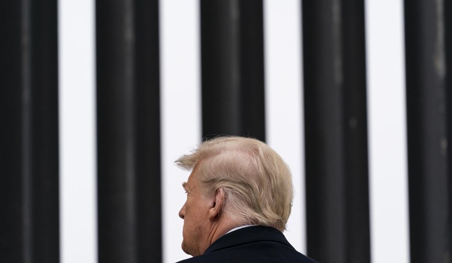 In this Jan. 12, 2021, photo, President Donald Trump tours a section of the U.S.-Mexico border wall in Alamo, Texas. During the Trump administration&#39;s final weeks, the Department of Homeland Security quietly signed agreements with at least four states that threaten to temporarily derail President Joe Biden&#39;s efforts to undo his predecessor&#39;s immigration policies. (AP Photo/Alex Brandon) **FILE**