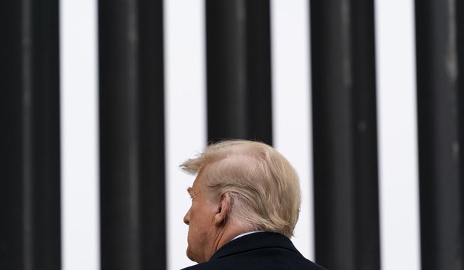 In this Jan. 12, 2021, photo, President Donald Trump tours a section of the U.S.-Mexico border wall in Alamo, Texas. During the Trump administration&#x27;s final weeks, the Department of Homeland Security quietly signed agreements with at least four states that threaten to temporarily derail President Joe Biden&#x27;s efforts to undo his predecessor&#x27;s immigration policies. (AP Photo/Alex Brandon) **FILE**