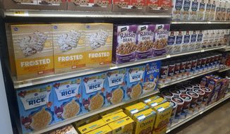In this photo provided by Paul Juarez, cereal and other foods line the shelves of Linda Tutt High School&#x27;s student-led grocery store on Nov. 20, 2020, in Sanger, Texas. (Paul Juarez via AP)