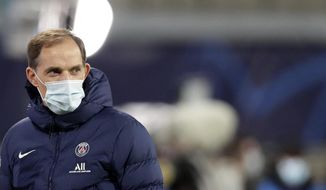 FILE - In this file photo dated Wednesday, Nov. 4, 2020, PSG&#39;s head coach Thomas Tuchel looks on during warm up before the Champions League group H soccer match against RB Leipzig at the RB Arena in Leipzig, Germany. Thomas Tuchel is confirmed as the new Chelsea soccer team manager, Tuesday Jan. 26, 2021.(AP Photo/Michael Sohn, FILE)