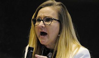 Sen. Amanda Chase, R-Chesterfield, speaks vigorously against passage of SR91, the resolution censuring her during the floor session of the Virginia Senate inside the Science Museum in Richmond, Va. Tuesday, Jan. 26, 2021. (Bob Brown/Richmond Times-Dispatch via AP)