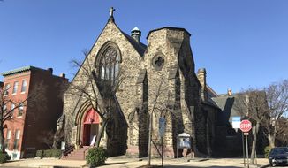 This March 22, 2017, photo provided by Religion News Service shows Memorial Episcopal Church in Baltimore. The historic church has committed to setting aside $100,000 to reparations, an initiative that will contribute to local racial justice causes. Memorial Episcopal Church has also pledged to contribute an additional $400,000 for reparations and justice over five years. (Courtesy of Eli Pousson/Flickr/Religion News Service via AP)  **FILE**