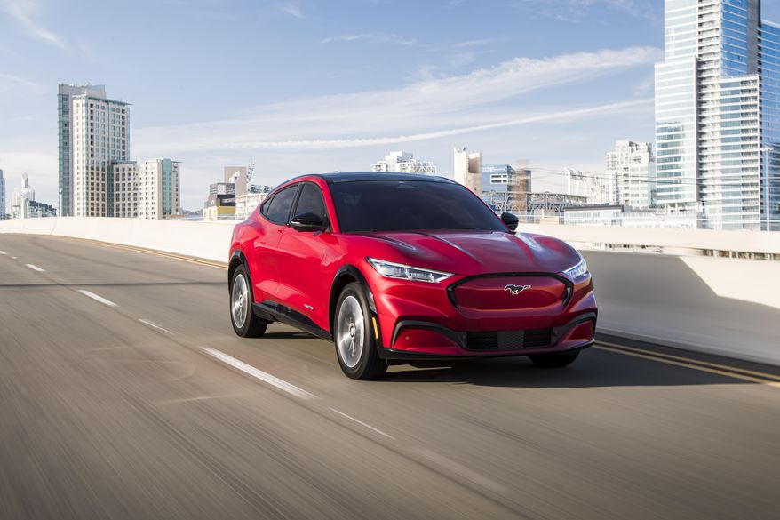 This photo provided by Ford shows the 2021 Ford Mustang Mach-E, an all-new compact electric compact SUV. (James Lipman /Ford Motor Co. via AP)