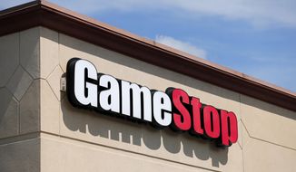 FILE - In this May 7, 2020 file photo, a GameStop store is seen in St. Louis. Two hedge funds are bowing out of their short positions on the money-losing video game retailer. Citron Research’s Andrew Left said in a video posted on YouTube that his company is going to become more judicious in shorting stocks. Melvin Capital is also exiting GameStop, with manager Gabe Plotkin telling CNBC that the hedge fund was taking a significant loss. (AP Photo/Jeff Roberson, File)