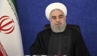 In this Jan. 7, 2021, file photo released by the official website of the office of the Iranian Presidency, President Hassan Rouhani attends a meeting in Tehran, Iran. (Iranian Presidency Office via AP, File)