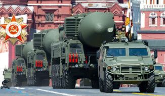 In this file photo taken on Wednesday, June 24, 2020, Russian RS-24 Yars ballistic missiles roll in Red Square during the Victory Day military parade marking the 75th anniversary of the Nazi defeat in Moscow, Russia. Russia and the United States exchanged documents Tuesday, Jan. 26, 2021, to extend the New START nuclear treaty, their last remaining arms control pact, the Kremlin said. The Kremlin readout of a phone call between U.S. President Joe Biden and Russian President Vladimir Putin said they voiced satisfaction with the move. (AP Photo/Alexander Zemlianichenko, File)