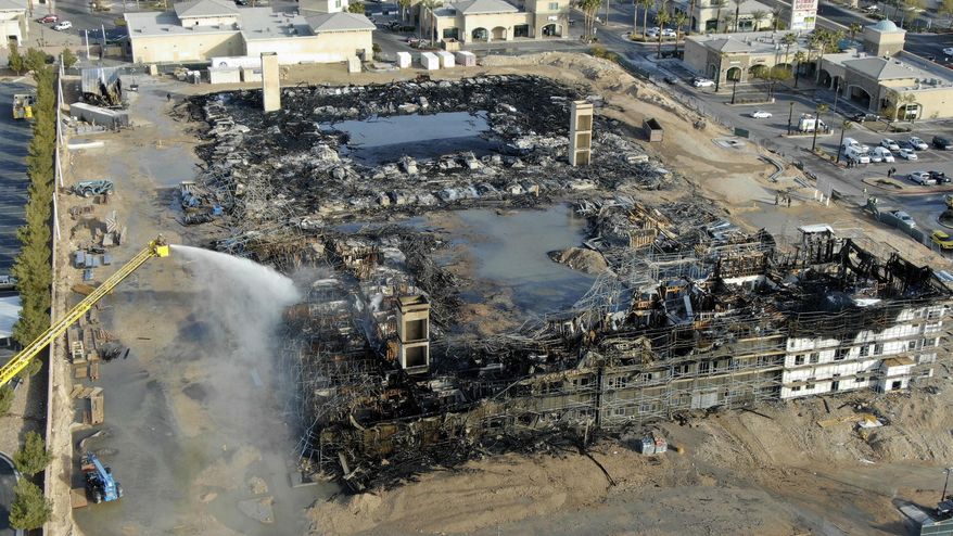 An aerial view of the damage after an overnight fire at an under-construction apartment complex in southwest Las Vegas on Tuesday, Jan. 19, 2021. (Michael Quine/Las Vegas Review-Journal via AP)