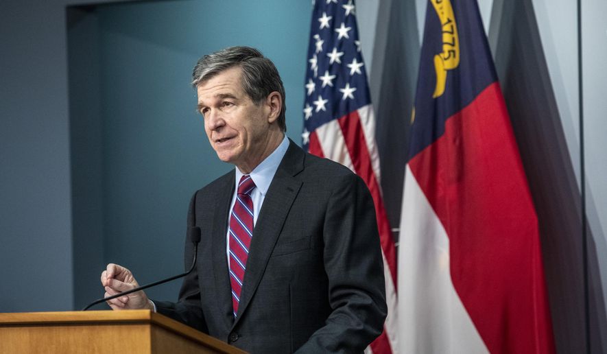 North Carolina Gov. Roy Cooper speaks during a briefing on North Carolina's coronavirus pandemic response Wednesday, Jan. 27, 2021 at the NC Emergency Operations Center in Raleigh, N.C. (Travis Long/The News & Observer via AP)