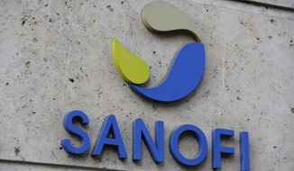 FILE - In this photo Nov.30, 2020 file photo the logo of French drug maker Sanofi is picture at the company&#39;s headquarters, in Paris. French drug maker Sanofi said Wednesday it will help manufacture 125 million doses of the coronavirus vaccine developed by rivals Pfizer and BioNTech, while its own vaccine candidate faces delays. (AP Photo/Thibault Camus, File)