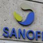 FILE - In this photo Nov.30, 2020 file photo the logo of French drug maker Sanofi is picture at the company&#39;s headquarters, in Paris. French drug maker Sanofi said Wednesday it will help manufacture 125 million doses of the coronavirus vaccine developed by rivals Pfizer and BioNTech, while its own vaccine candidate faces delays. (AP Photo/Thibault Camus, File)
