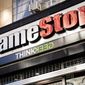 Pedestrians pass a GameStop store on 14th Street at Union Square, Thursday, Jan. 28, 2021, in the Manhattan borough of New York. Robinhood and other online trading platforms are moving to restrict trading in GameStop and other stocks that have soared recently due to rabid buying by smaller investors. GameStop stock has rocketed from below $20 to more than $400 this month as a volunteer army of investors on social media challenged big institutions who has placed market bets that the stock would fall. (AP Photo/John Minchillo)