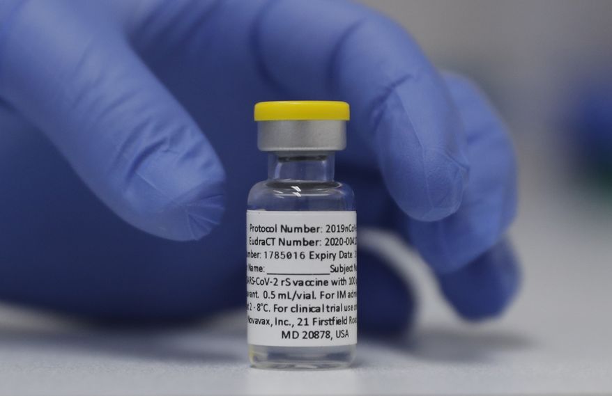 A vial of the Phase 3 Novavax coronavirus vaccine is seen ready for use in the trial at St. George's University hospital in London Wednesday, Oct. 7, 2020. Novavax Inc. said Thursday Jan. 28, 2021 that its COVID-19 vaccine appears 89% effective based on early findings from a British study and that it also seems to work though not as well against new mutated strains of the virus circulating in that country and South Africa. (AP Photo/Alastair Grant) **FILE**
