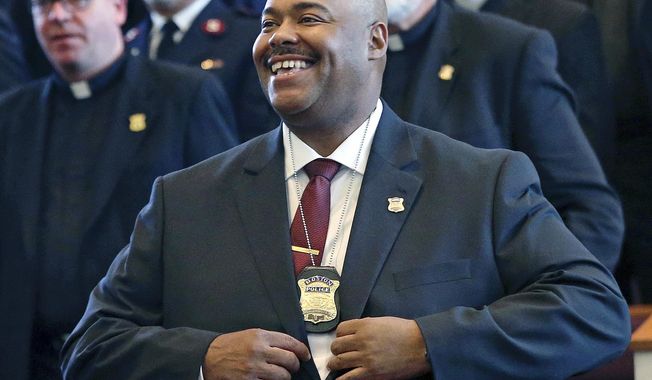FILE - In this Aug. 6, 2018 file photo, William Gross smiles after being sworn in as Boston&#x27;s first black police commissioner during ceremonies in Boston. Gross plans to retire on Friday Jan. 29, 2021. (AP Photo/Elise Amendola, File)