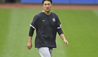 FILE - New York Yankees starting pitcher Masahiro Tanaka walks on the field before Game 1 of an American League wild-card baseball series against the Cleveland Indians in Cleveland, in this Tuesday, Sept. 29, 2020, file photo. Former New York Yankees pitcher Masahiro Tanaka has signed a two-year contract with the Rakuten Eagles in Japanese baseball, the club said Thursday, Jan. 28, 2021. (AP Photo/David Dermer, File)