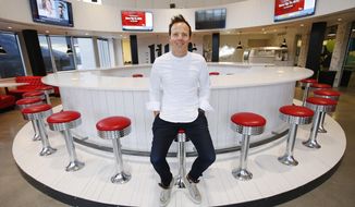FILE - In this Feb. 2, 2018, file photo, Qualtrics CEO Ryan Smith poses in the Hub at the company&#39;s headquarters in Orem, Utah. Survey-software provider Qualtrics went public Thursday, Jan. 28, 2021, two years after German software giant SAP bought the company for $8 billion, marking the latest achievement for a company that has become one of the crown jewels of a technology corridor near Salt Lake City that Utah likes to call &amp;quot;Silicon Slopes.&amp;quot;  (Jeffrey D. Allred/The Deseret News via AP)
